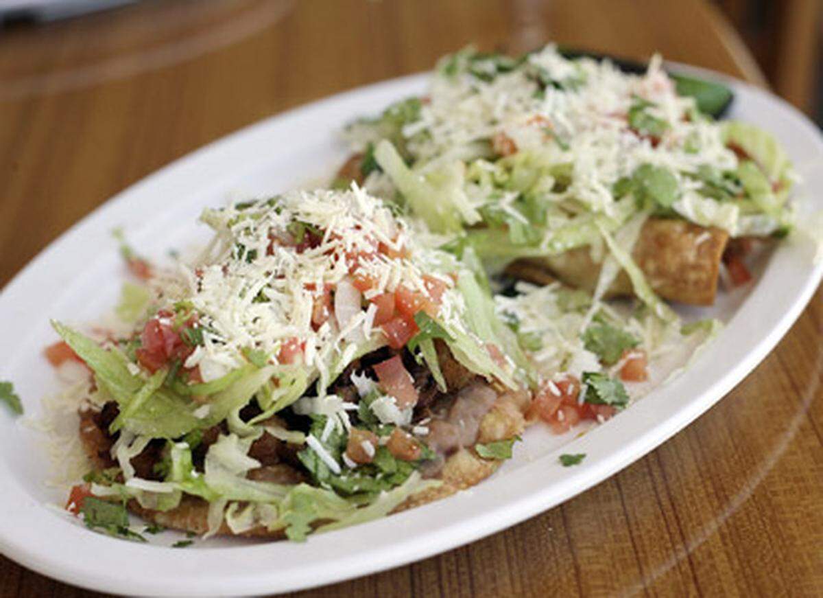 The Tostada al Pastor and Flautas plate at Antojitos Mexicanos restaurant in Homestead, Fl. Photo: David Adame.