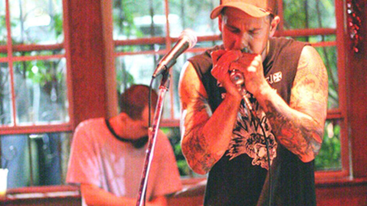 Juke's Eric Garcia works the harmonica like no one's business.