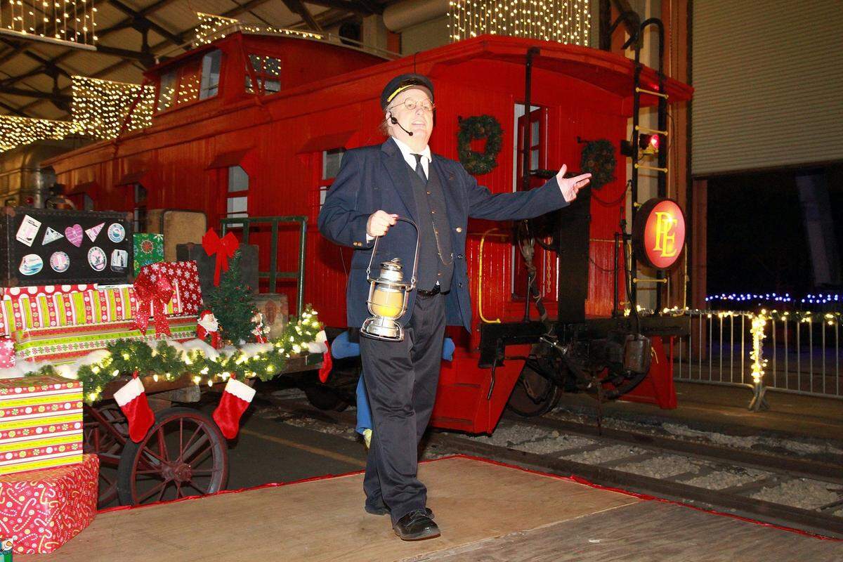 Sam Chesser, as the conductor, acts in a skit kicking off the Polar Express Train Ride's visit to Miami at the Gold Coast Railroad Museum in West Kendall, on Friday, Nov. 27, 2015. The classic children's book is brought to life as the Polar Express is stationed at the Gold Coast Railroad Museum available for rides through Dec. 27. For more information and tickets, visit www.gcrm.org