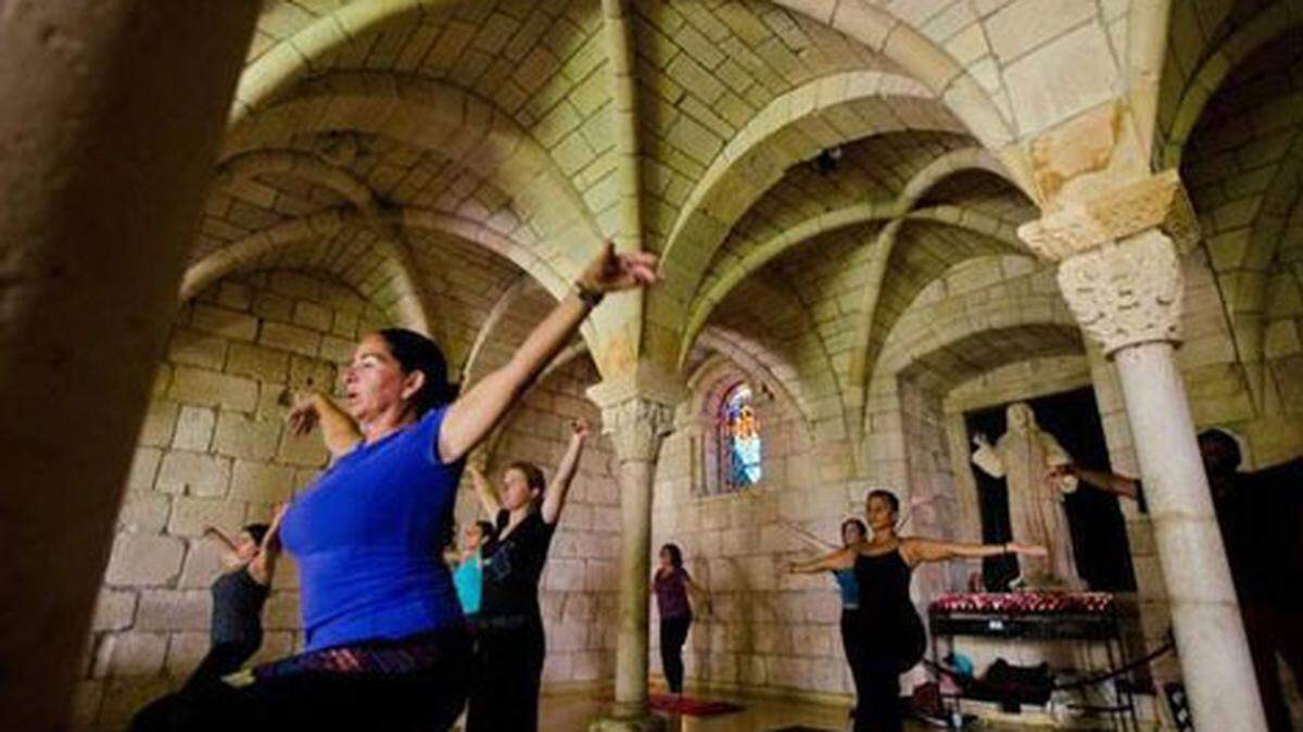 Marisa Rivera, 54, practices her posture during a Borba Healing Yoga class at the Ancient Spanish Monastery. Max Reed