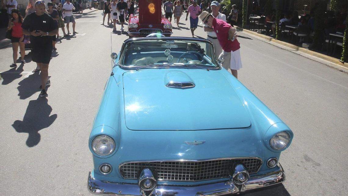 At right, brothers Jerry Schmidt of Fresno, Calif., and Joseph Schmidt of Ridgewood, New Jersey, far right, look at a vintage Thunderbird during the Miami Design Preservation League's 39th annual Art Deco Weekend.