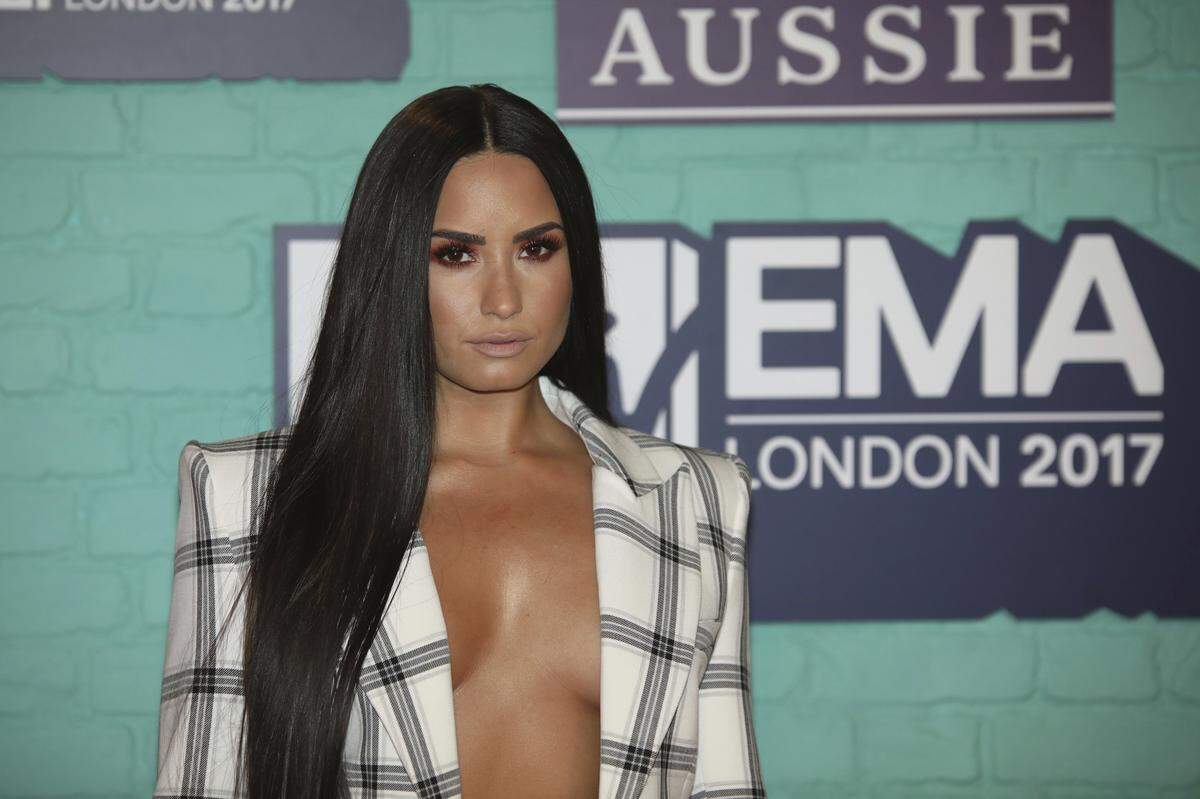 Singer Demi Lovato poses for photographers upon arrival at the MTV European Music Awards 2017 in London, Sunday, Nov. 12th, 2017. (Photo by Vianney Le Caer/Invision/AP)