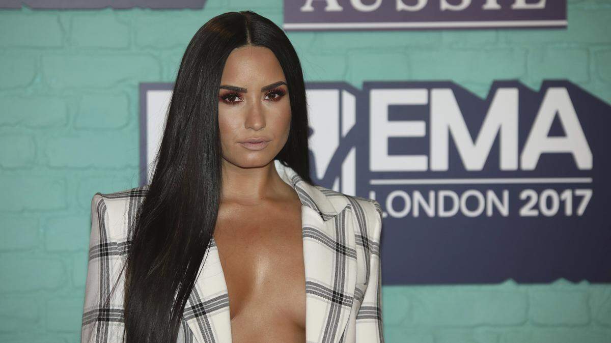 Singer Demi Lovato poses for photographers upon arrival at the MTV European Music Awards 2017 in London, Sunday, Nov. 12th, 2017. (Photo by Vianney Le Caer/Invision/AP)