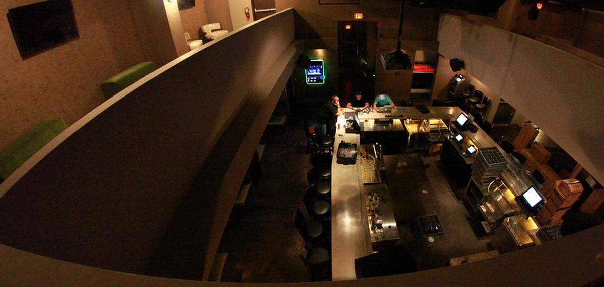 The new underground bar on Miami Beach has a speakeasy feel, with its entrance located in an alley, a selection of arcade games, and gun case with vintage firearms.(Tomas Loewy)