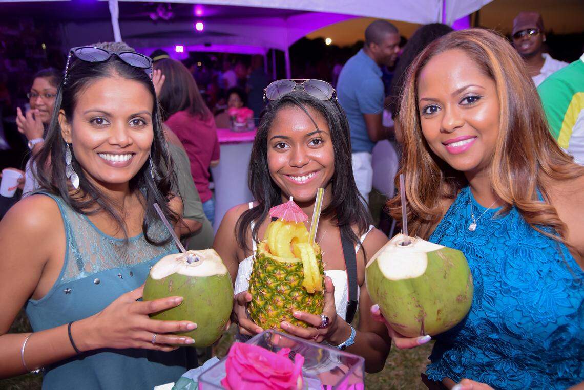 Revelers hang out at the Grace Jamaican Jerk Festival.
