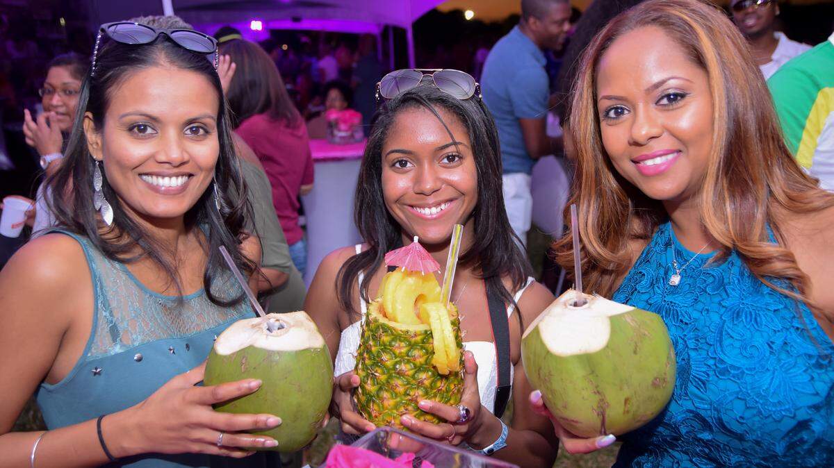 Revelers hang out at the Grace Jamaican Jerk Festival.