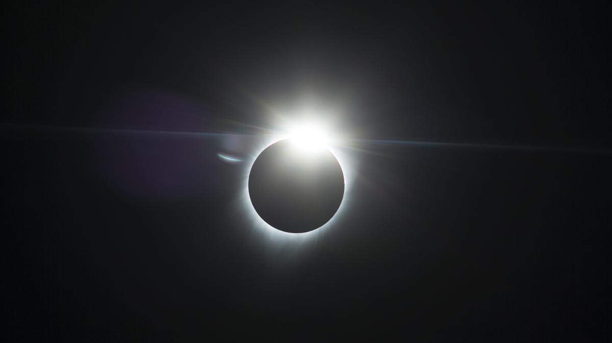 The moon partially covers the sun during an eclipse Monday, Aug. 21, 2017, near Redmond, Ore. (AP Photo/Timothy J. Gonzalez)