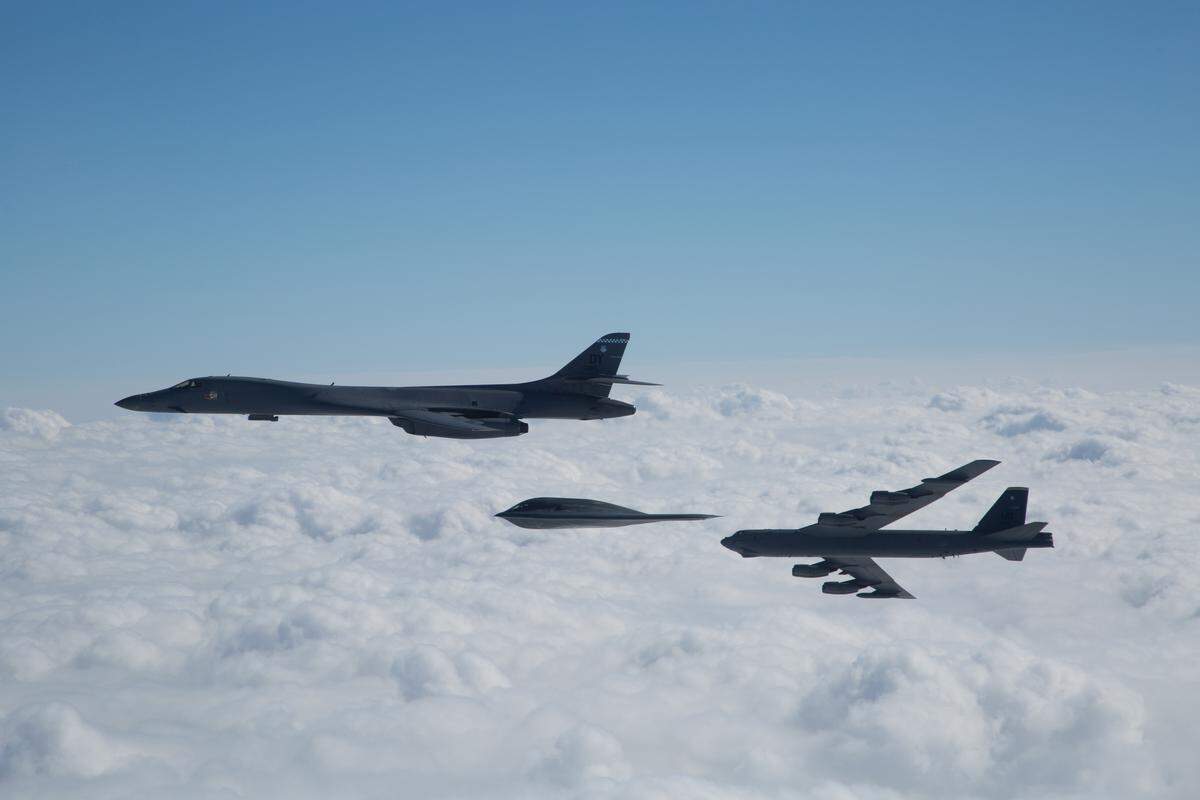 A three-ship bomber formation composed of a B-1B Lancer, B-2 Spirit and B-52 Stratofortress fly near Barksdale Air Force Base, La., Feb. 2, 2017. The bombers participated in an in-trail formation flyover to honor and commemorate the Eighth Air Force’s 75th anniversary. (U.S. Air Force courtesy photo by Sagar Pathak)