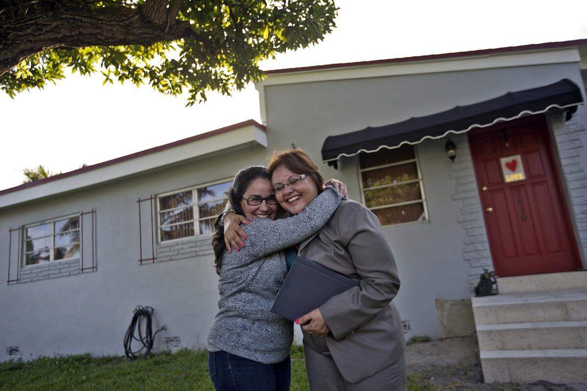 This lady just bought a house in Westchester and she is so amped she is hugging her realtor.