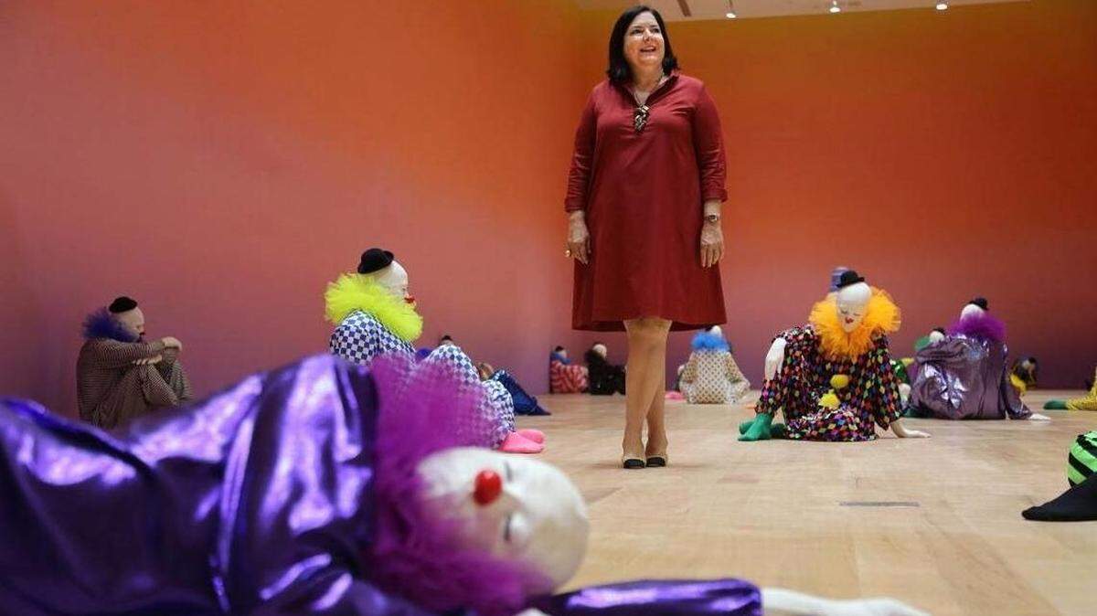 Is that clown sleeping or just trying to lure Bass museum executive director Silvia Karman Cubina into a false sense of security?
