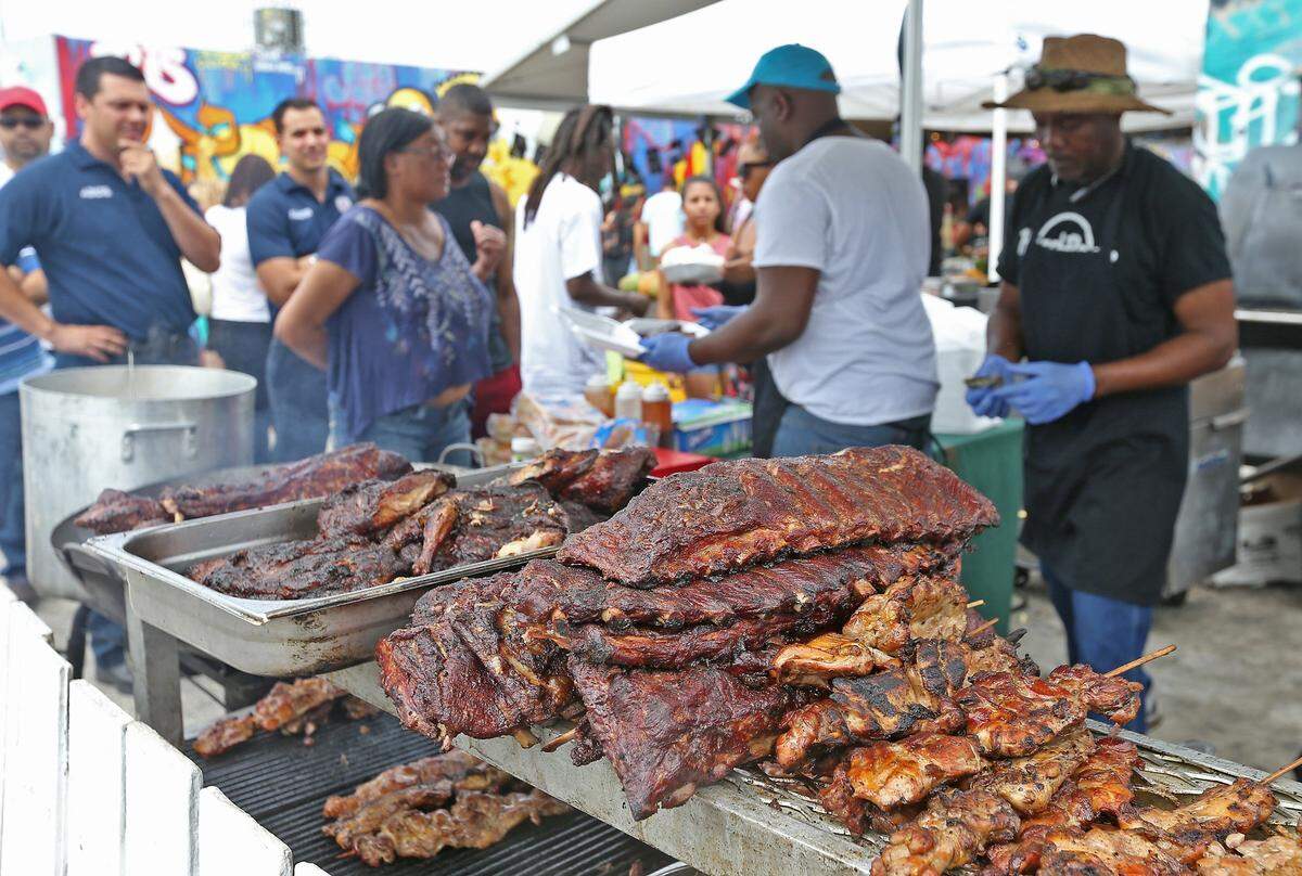 Some ribs and chicken are prepared by Eat Da Bone BBQ as Miami kicks off BBQ season for the whole family with Grillin N Chillin, the Miami BBQ Festival held in Wynwood on Sunday, April 3, 2016.