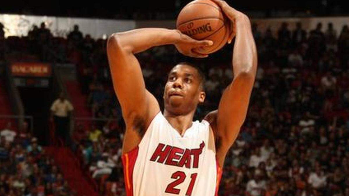 Miami Heat center Hassan Whiteside prepares to shoot a free throw against the Orlando Magic at AmericanAirlines Arena in Miami on Dec. 29, 2014.