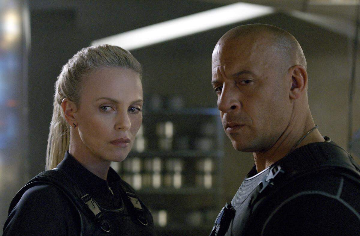 This image released by Universal Pictures shows Charlize Theron, left, and Vin Diesel in "The Fate of the Furious." (Universal Pictures via AP)