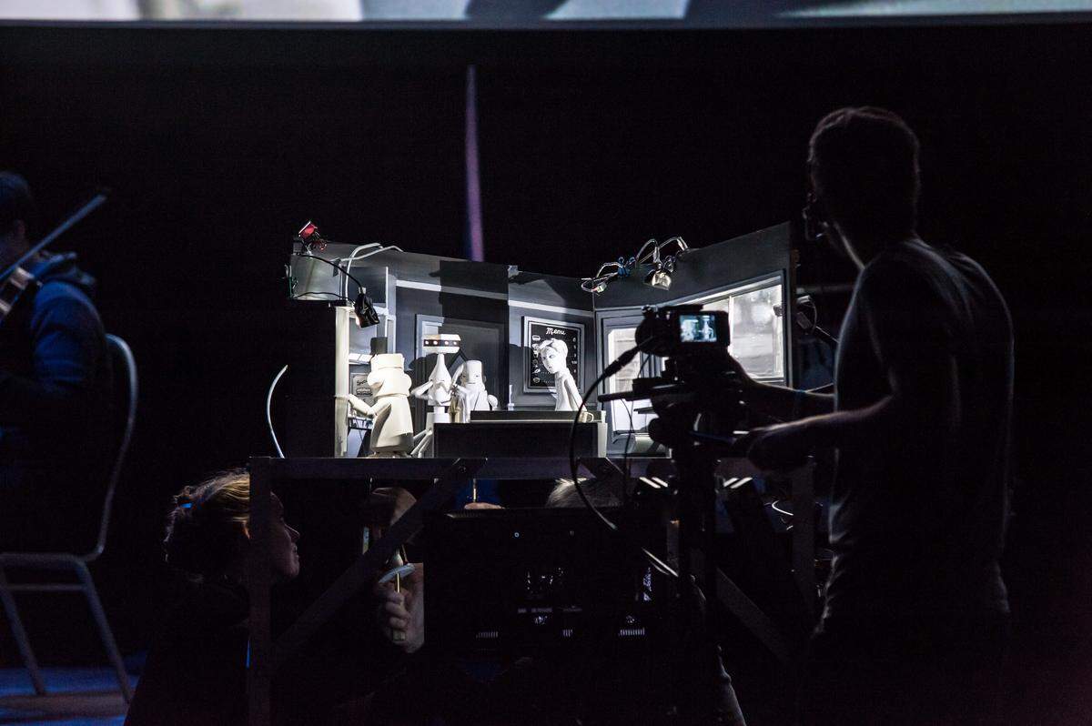 The folks behind the curtain are part of the show at "Nufonia Must Fall," Kid Koala's show about robot love.