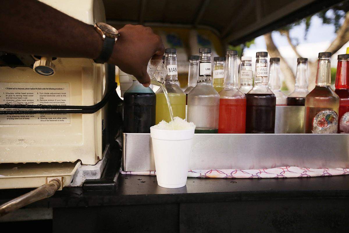 Eddie Baronvillind, makes drinks for Maui-Wowee flavors at The Madame Gougousse Tournament Finals, at FIU North Campus on Sunday September 11th., 2016.