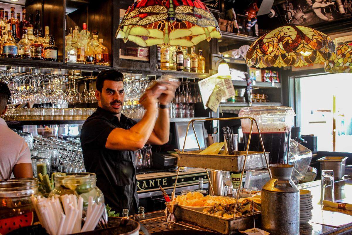 A  bartender shakes up at drink at Havana 1957.