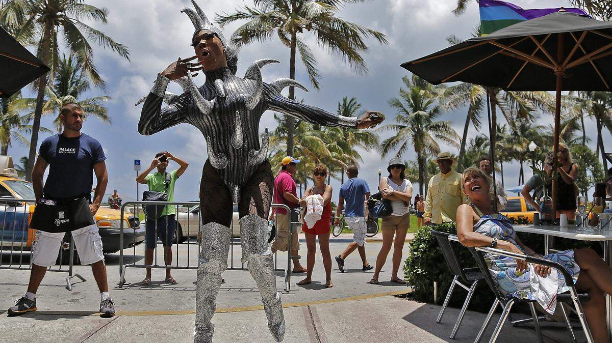 "Missy Meyakie Lapaige" , whose real name is Cornelius Boothe, does her act for the crowd during the drag show at Sunday brunch at the Palace Bar, the only gay bar on Ocean Drive, in Miami Beach on Sunday, June 10, 2012.