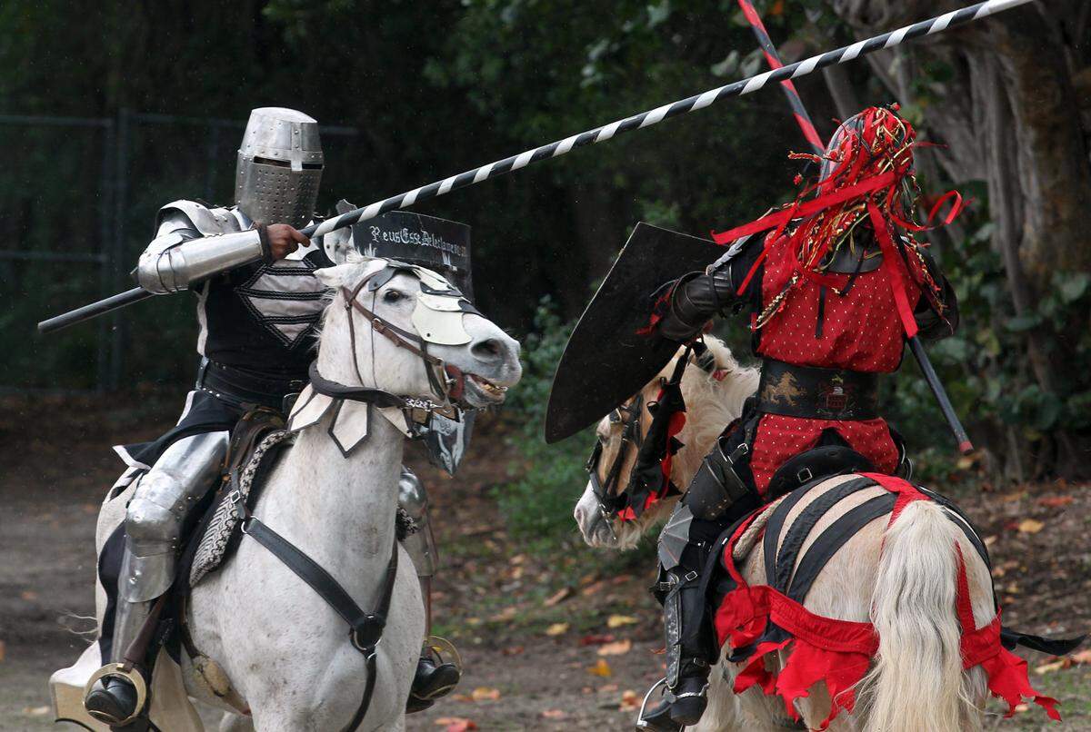 Flex Sanchez, (left) and Brian Fertal, (right) jousting at  Jungle Island, who hosted the Florida Renaissance Festival. The festival had a number of whimsical festivities, among the events that took place include jousting, historical reenactments, magicians and wenches. The event started Saturday, March 22nd, 2014, and also on Sunday.
