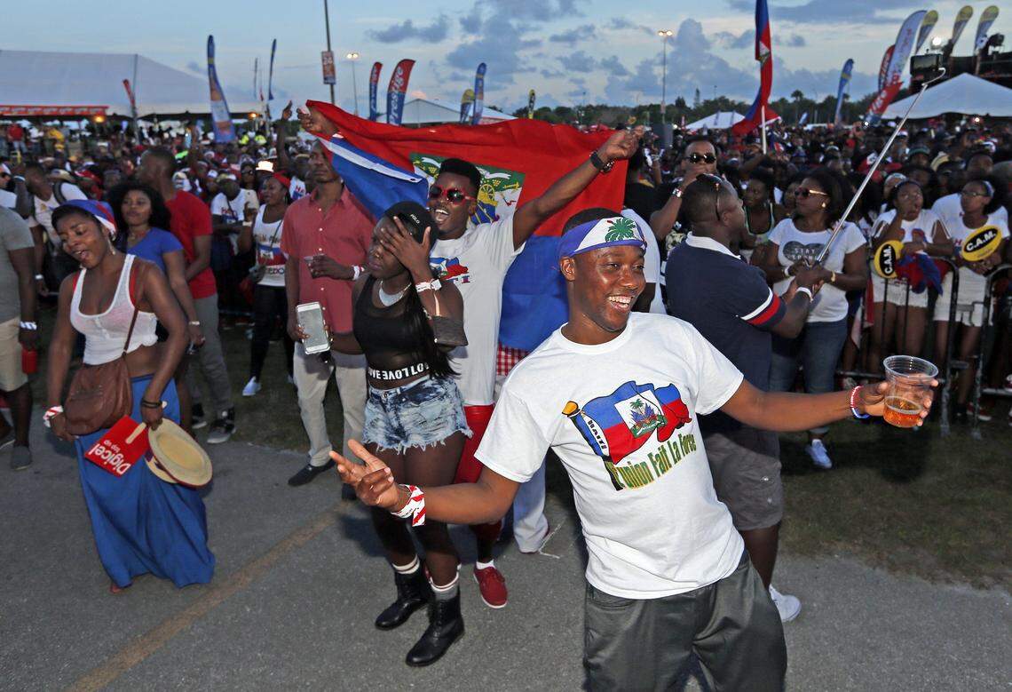 Guerlins Dareus dances to the beat of performers during the Haitian Compas Festival at Sun Life Stadium on Saturday, May 16, 2015.
