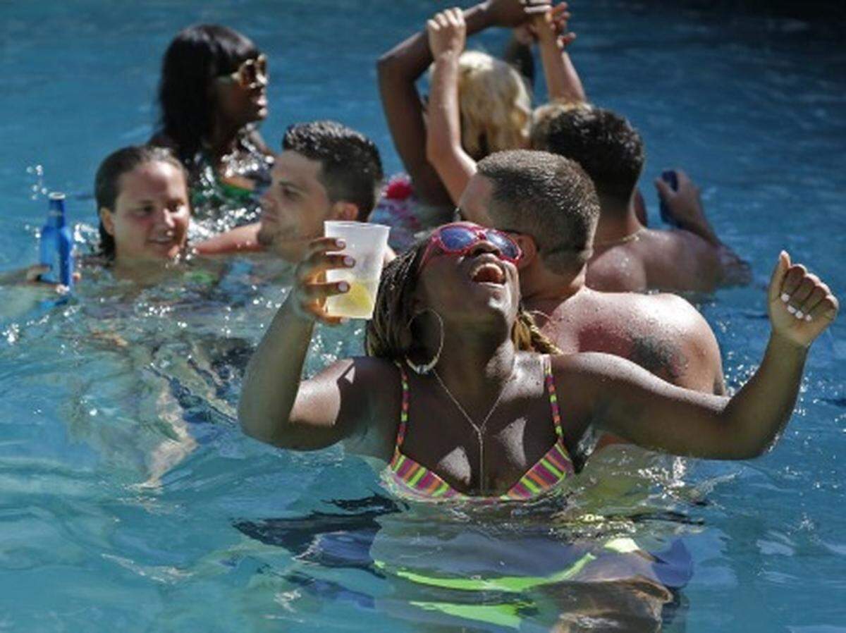 Urban Beach Week revelers party and have a good time at pool inside the Clevelander Hotel in Miami Beach. PHOTO: Carl Juste