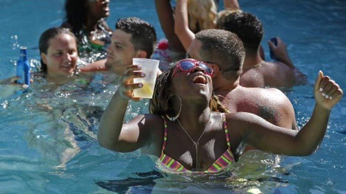 Urban Beach Week revelers party and have a good time at pool inside the Clevelander Hotel in Miami Beach. PHOTO: Carl Juste