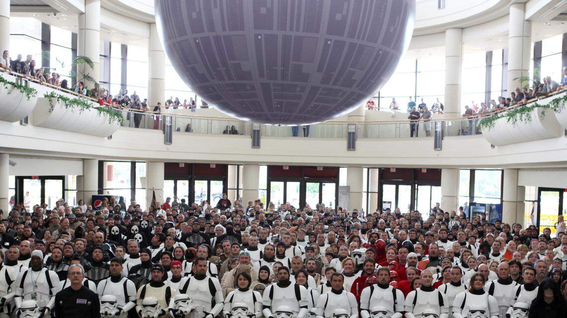 The Force of fans. Costumed Star Wars fans gather under the Celebration Death Star.