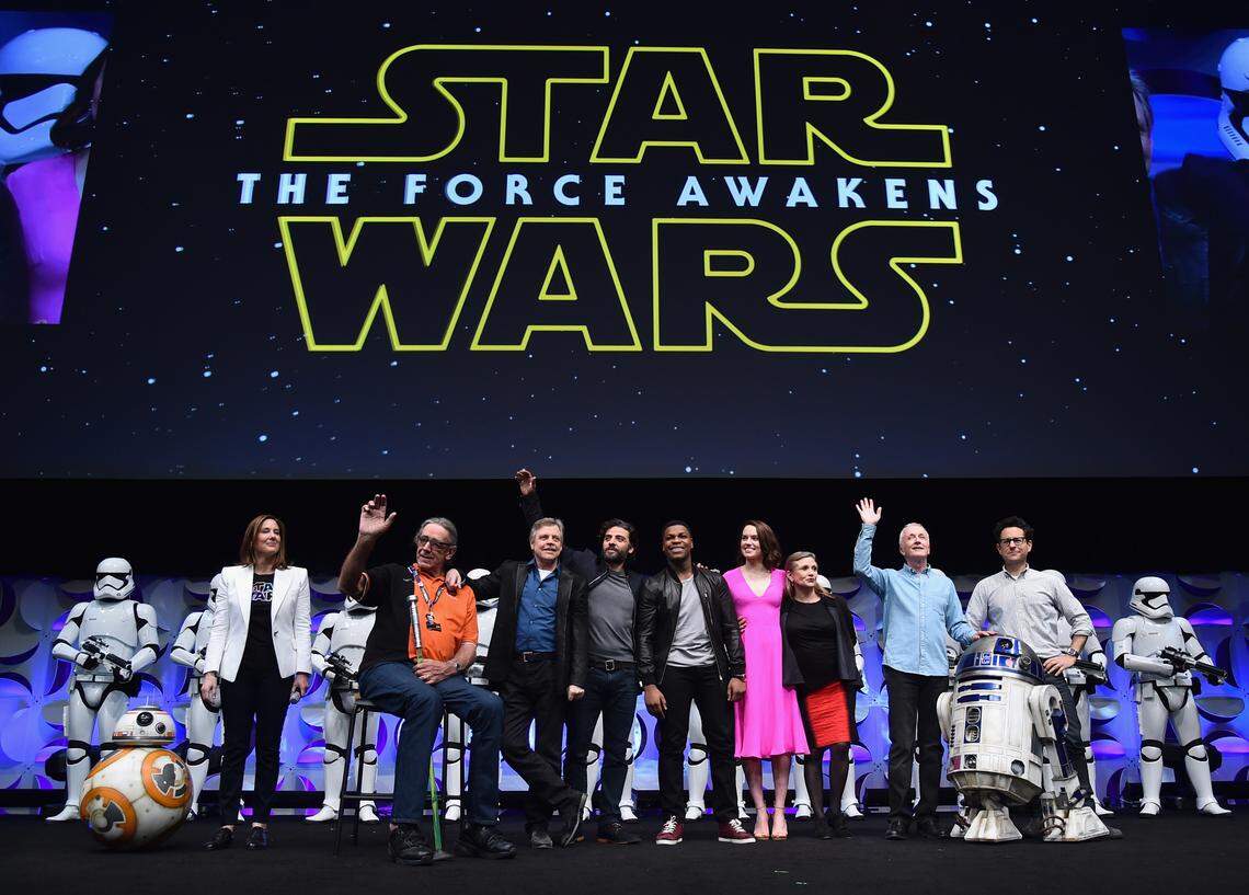 ANAHEIM, CA - APRIL 16:  (L-R) Producer Kathleen Kennedy, actors Peter Mayhew, Mark Hamill, Oscar Isaac, John Boyega, Daisy Ridley, Carrie Fisher, Anthony Daniels and director J.J. Abrams speak onstage during Star Wars Celebration 2015 on April 16, 2015 in Anaheim, California.  (Photo by Alberto E. Rodriguez/Getty Images for Disney)
