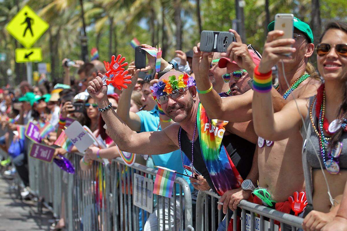 Fans cheer along the parade route on Ocean Drive at the annual Miami Beach Gay Pride Parade and Festival on Sunday, April 10, 2016.