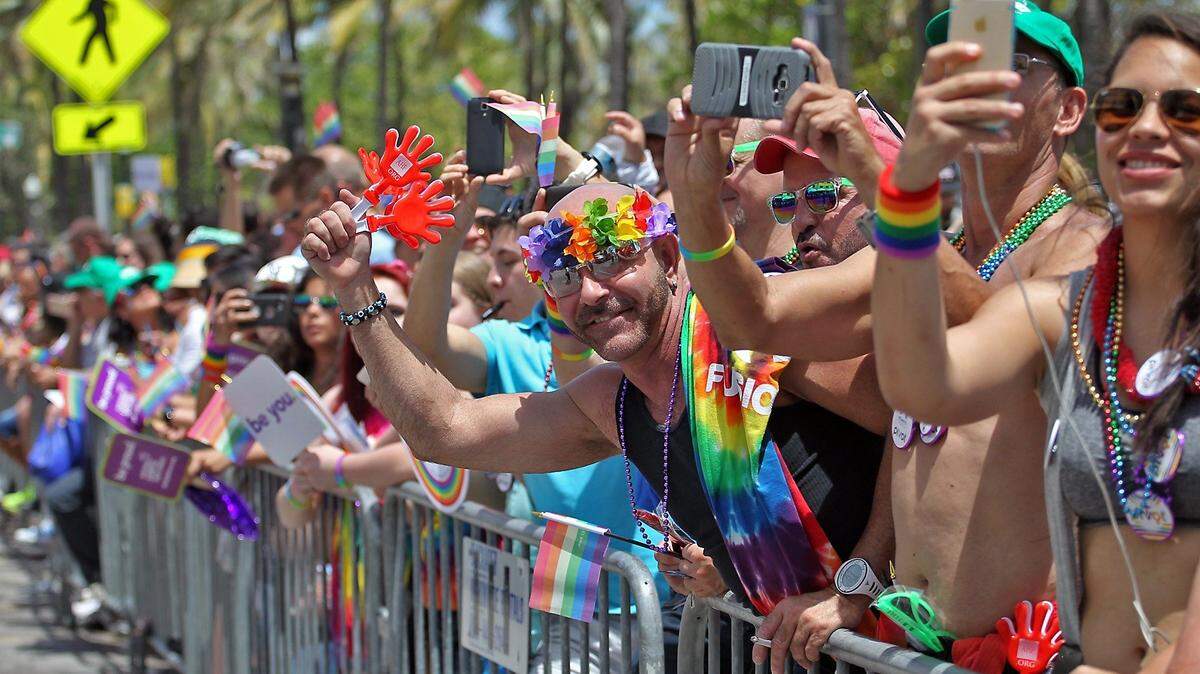 Fans cheer along the parade route on Ocean Drive at the annual Miami Beach Gay Pride Parade and Festival on Sunday, April 10, 2016.