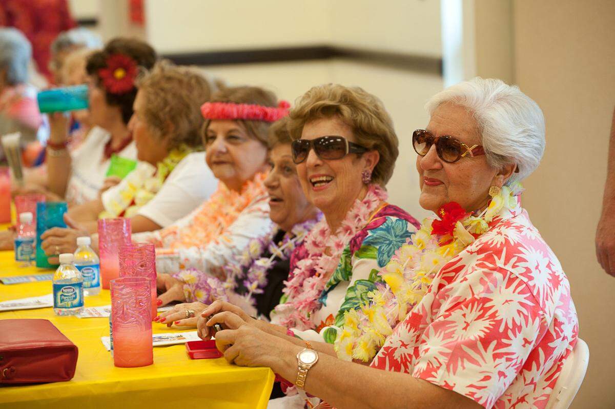 Miami Lakes resident Maritza Chavez and about 200 others attend the Senior Hawaiian Luau at Royal Oaks Park Community Center in Miami Lake.