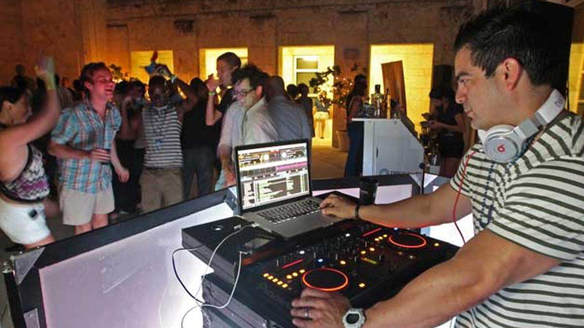 DJ Joseph Anthony mixes the music at Miami Beach's Bass Museum of Art's Beats After Sunset. Photo: Al Diaz