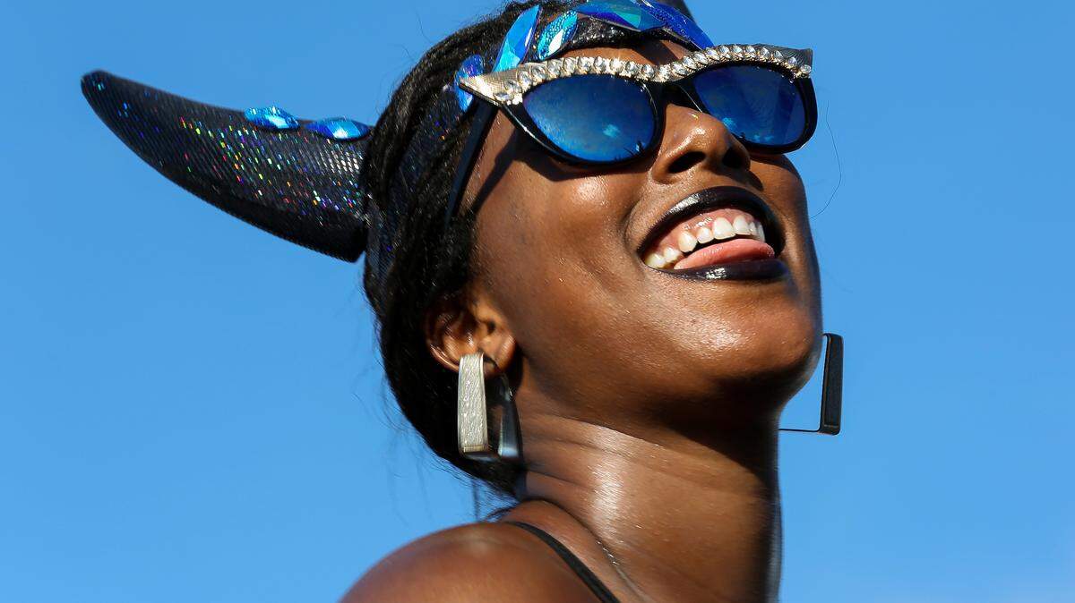 A dancer reacts after performing at the Miami Carnival Parade of Bands during the Miami Broward One Carnival in the Miami-Dade County Fair and Exposition grounds on Sunday, Oct. 8, 2017.