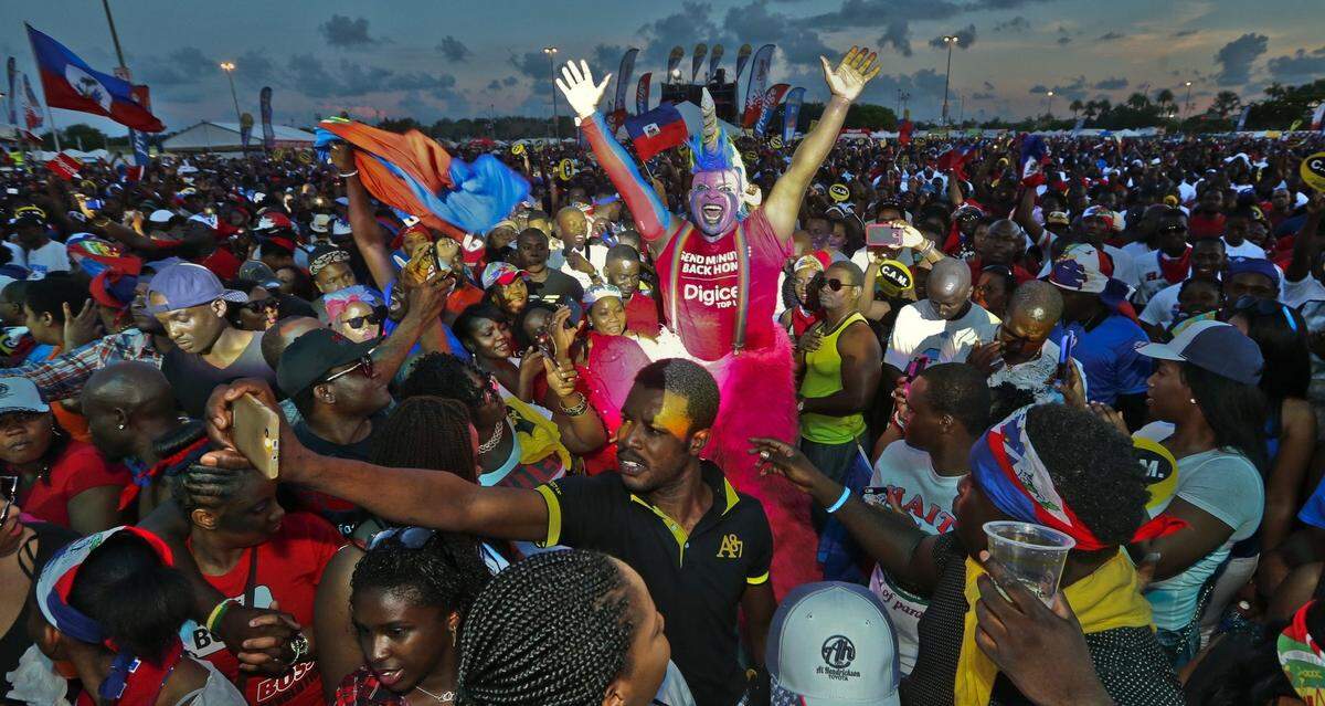 Attendees dance to the music during the Haitian Compas Festival at Sun Life Stadium  on  Saturday, May 16, 2015