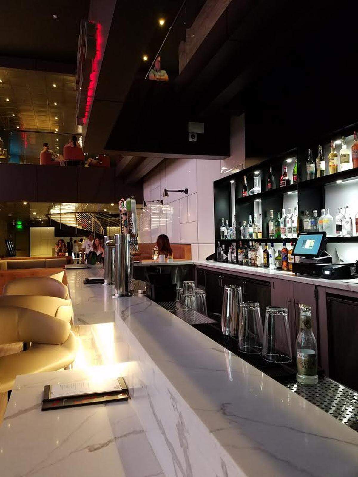 There's a bar upstairs and a bar downstairs. Take your pick.
