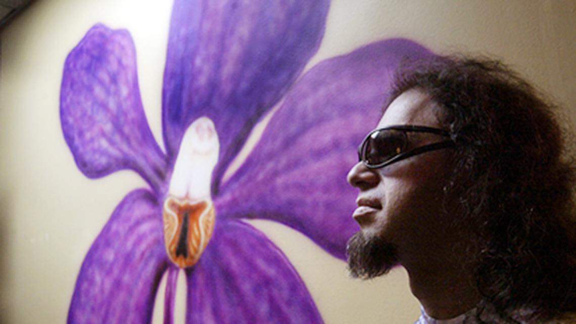 Flash, the owner of Wallflower Gallery stands in his art gallery.Photo By Nuri Vallbona