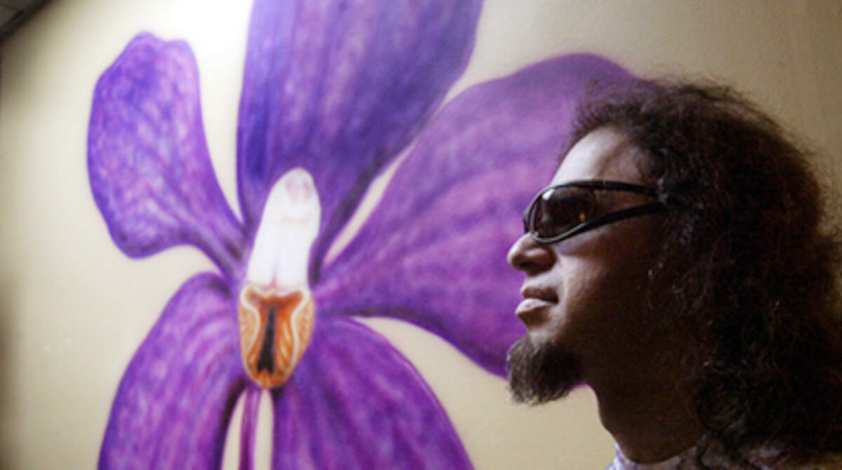 Flash, the owner of Wallflower Gallery stands in his art gallery.Photo By Nuri Vallbona