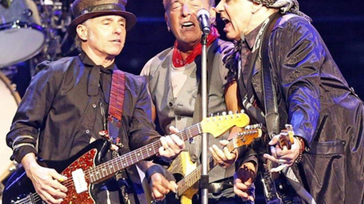 Bruce Springsteen (center) sings with Nils Lofgren and Steven Van Zandt as the E Street Band plays. Photo: Charles Trainor Jr