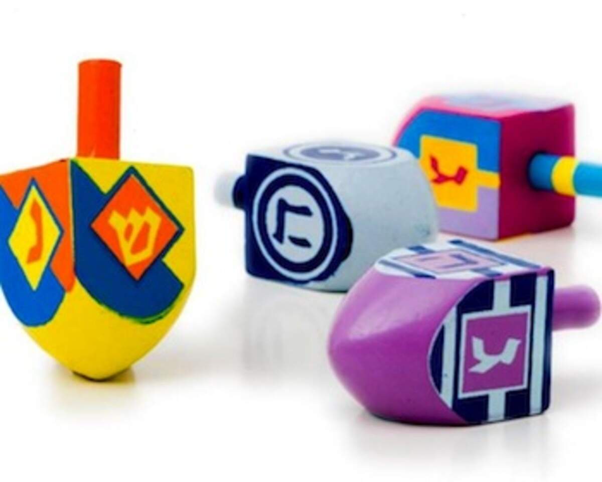 Set of four wooden dreidels.