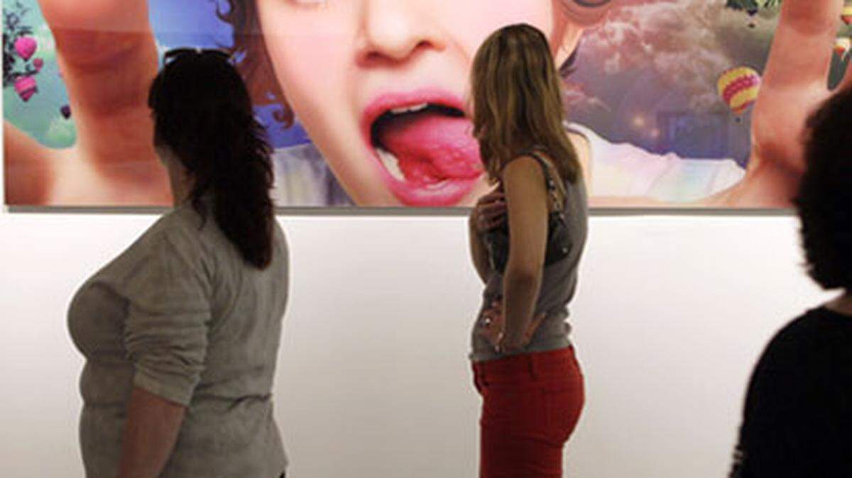 Second Saturdays in Wynwood is a free gallery walk that draws many young people out to the various art venues. Photo: Al Diaz.