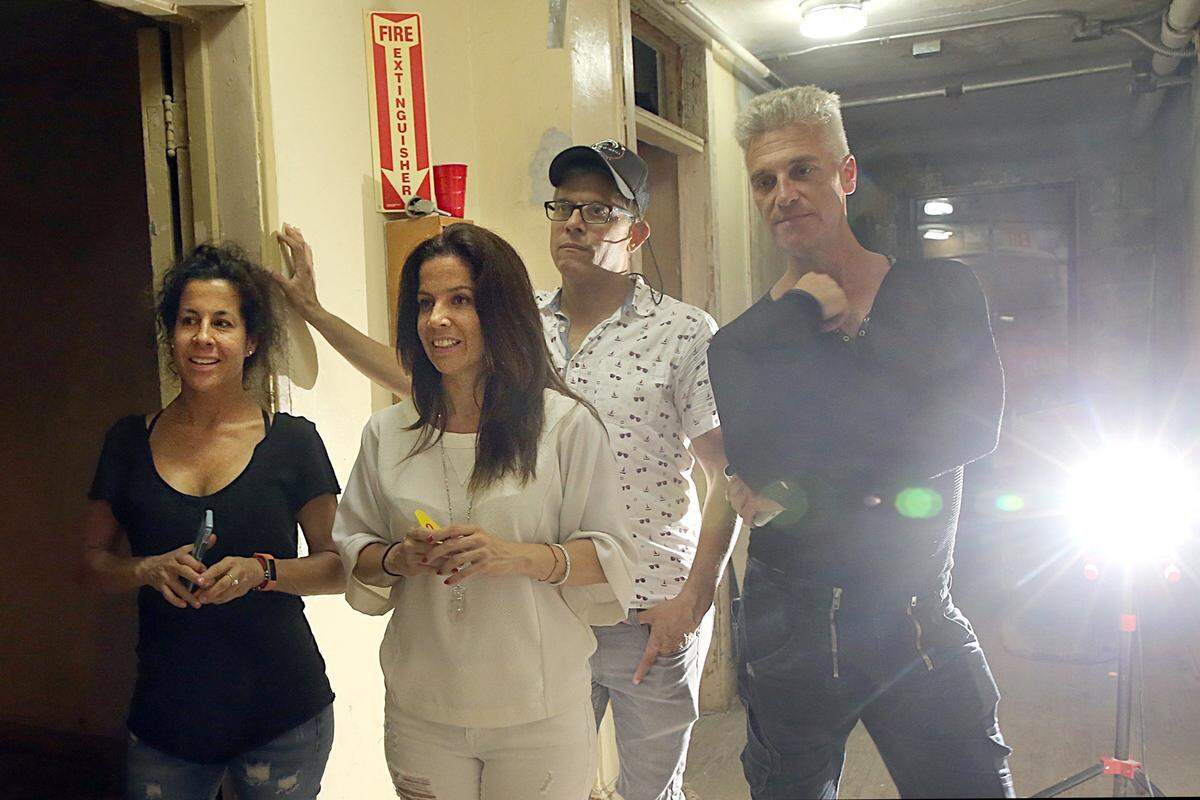 From left- Natasha Bravo, producer, director Tanya Bravo, playwright Juan C. Sanchez and movement director Octavio Campos during a rehearsal of some of the short plays written by Sanchez, directed by NYC's Tamilla Woodard and produced by Juggerknot Theatre Company as part of Miami Motel Stories, a real-time immersive theater experience that takes place inside one of Little Havana's most beautiful and iconic buildings - the Tower Hotel.