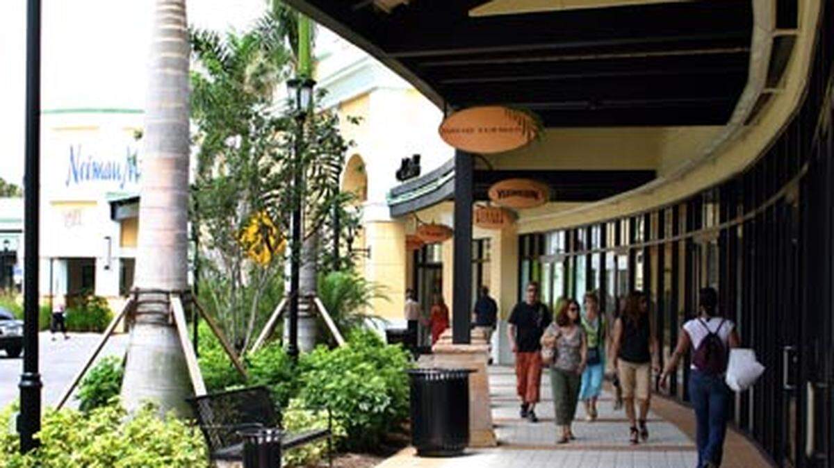 Shoppers stroll the Colonnade, a section of high-end outlets at Sawgrass Mills Mall in Sunrise. Photo: Beverly Bidney