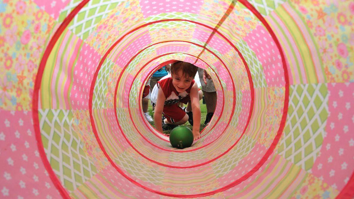 Local resident Ryan Levy, 5, completes part of an obstacle course during a field day for children with special needs at Royal Oaks Park in Miami Lakes.