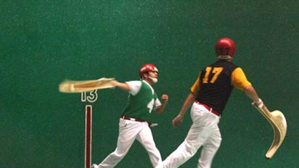 Jai alai players midgame at the Dania Jai Alai fronton. Photo: Dania Jai Alai
