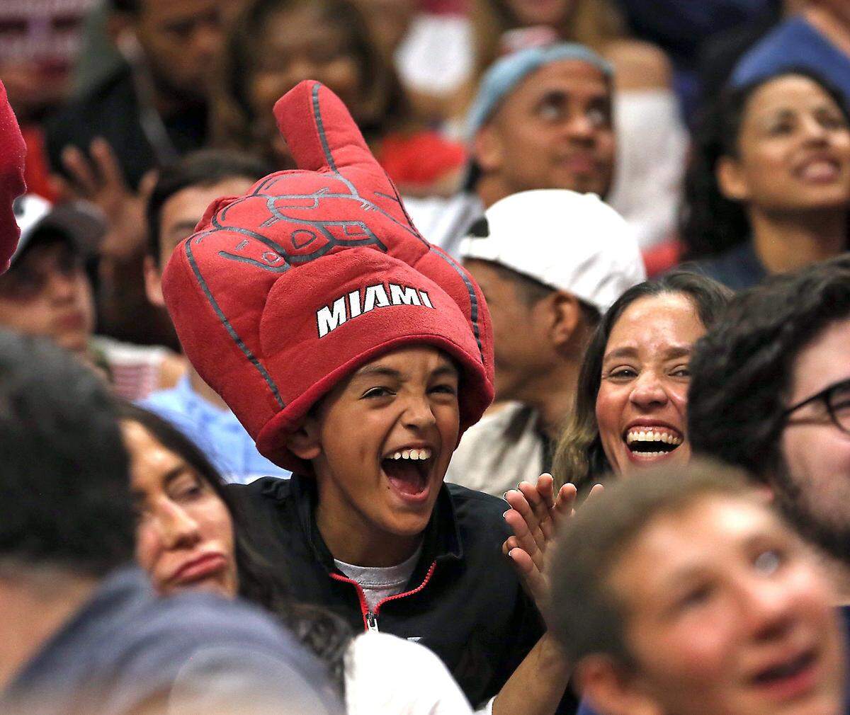 A young Heat fan enjoys the game as the Miami Heat host the Portland Trail Blazers on Sunday, March 19, 2017.