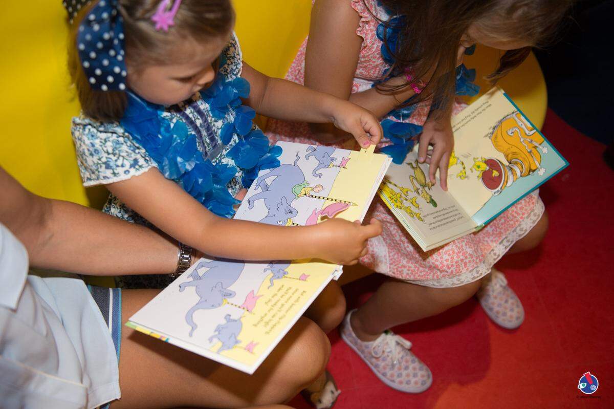 Kids get cozy reading in Dr. Seuss Bookville. Photo by Jason Koerner Photography