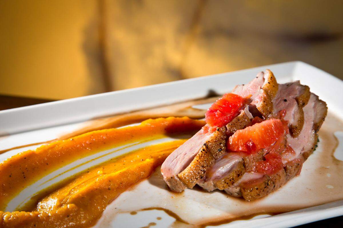 Mojo crispy chicken over roasted fufu puree at 3800 Ocean.