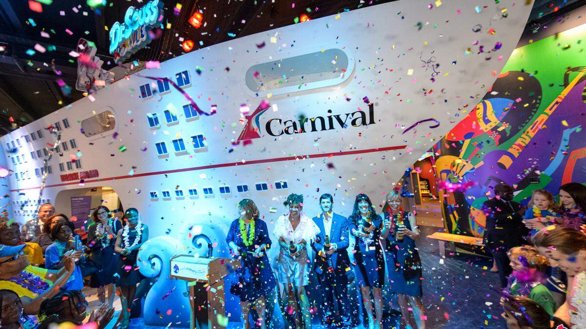 Confetti rains over visitors as Carnival Cruise Upper Deck exhibit debuts. Photo by Jason Koerner Photography.