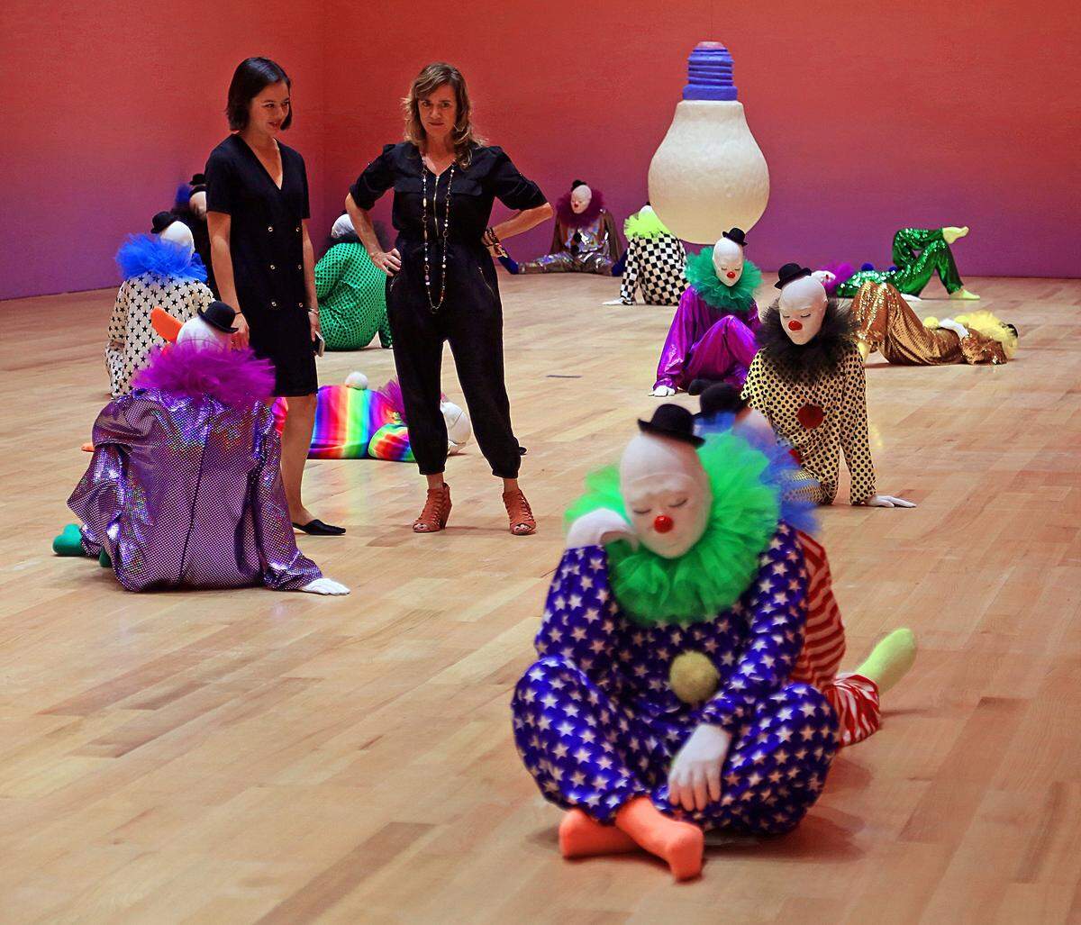 Assistant curator Leilani Lynch  and Megan Riley, director of external affairs, preview the exhibition clearly not realizing the danger they're in.