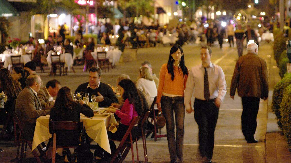 Tables were set out in the middle of the closed street so guests could enjoy an out side dining experience during Giralda Under the Stars in Coral Gables.