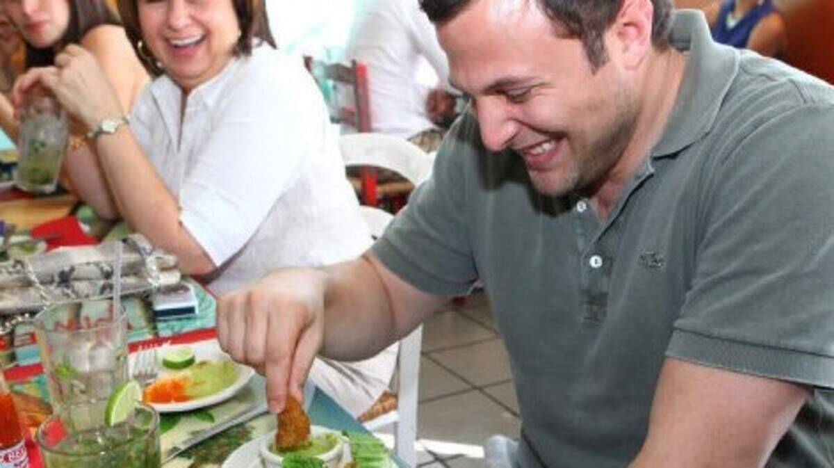 Jonathan Tosoia and his mother Kathy Tosoian at the famous TapTap Hatian Restaurant. Patricia Laylle / For The Miami Herald